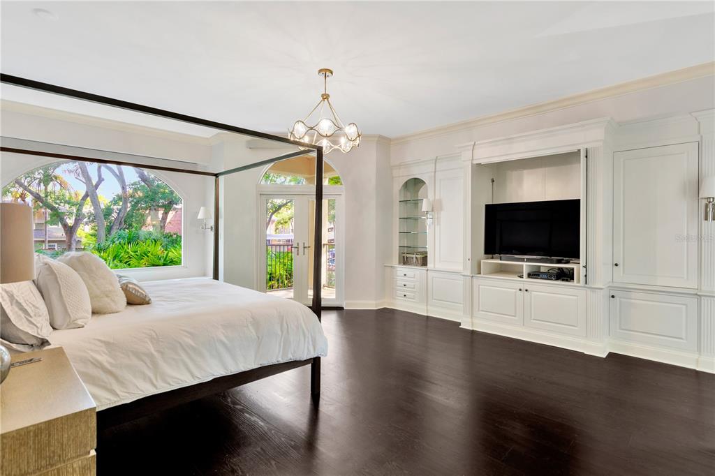 Spectacular master with built-in cabinetry and bookshelves plus a private terrace.