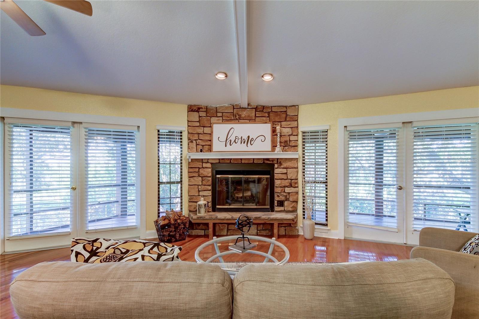 Fireplace; Doors Lead to Screened-in Porch
