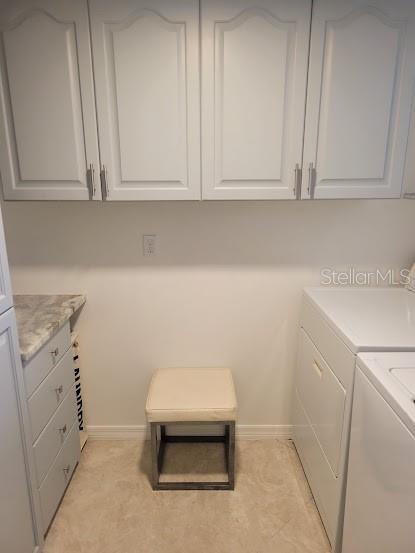 Laundry room with plenty of cabinets.