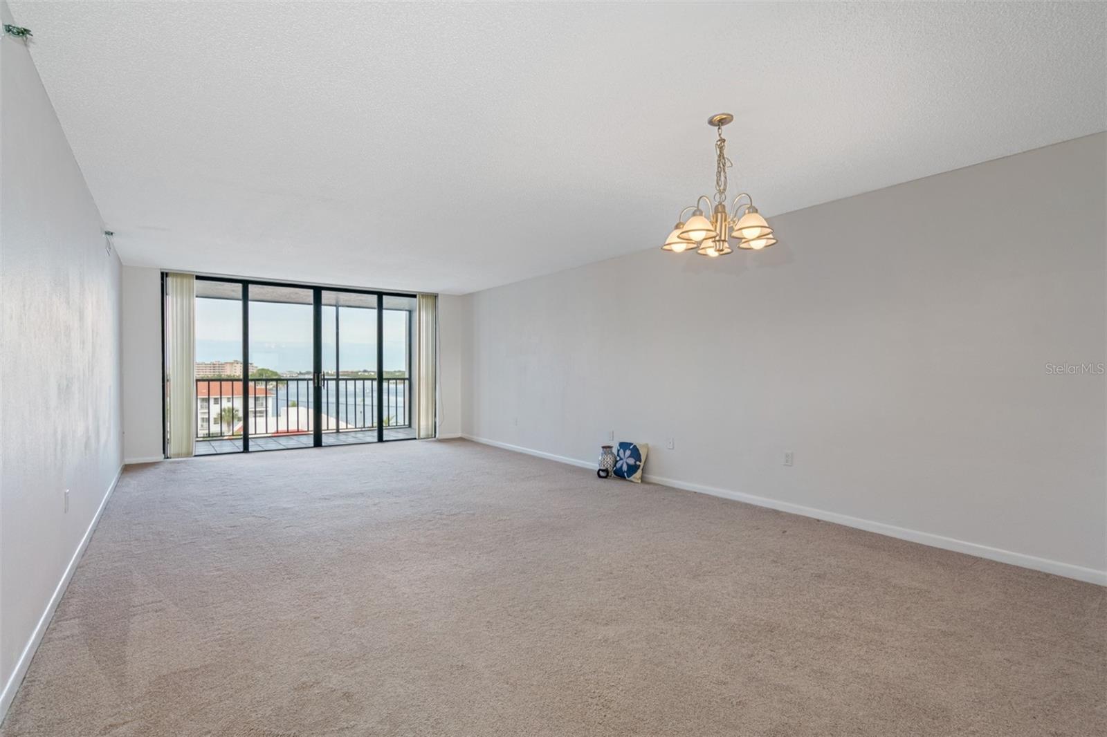 .. Large Great room Looking Towards Balcony,,. Large Great room Looking Toward Water Front Balcony.