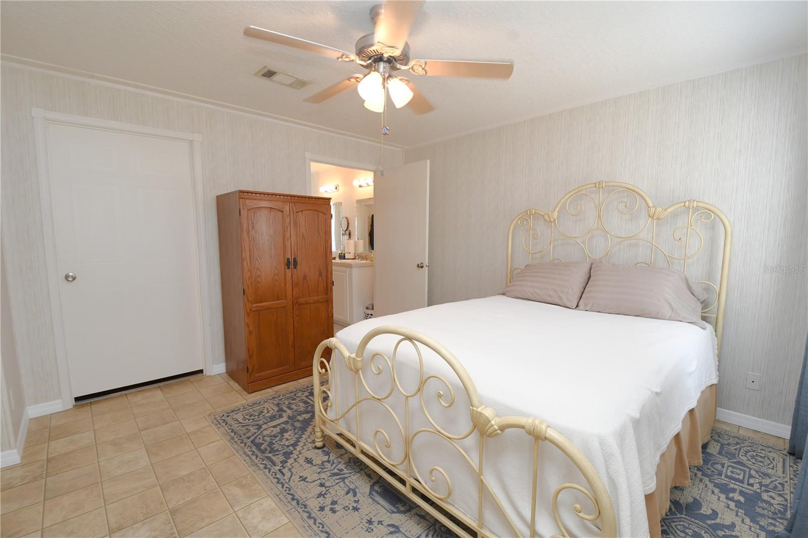 The master bedroom is spacious and has a large walk in closet.