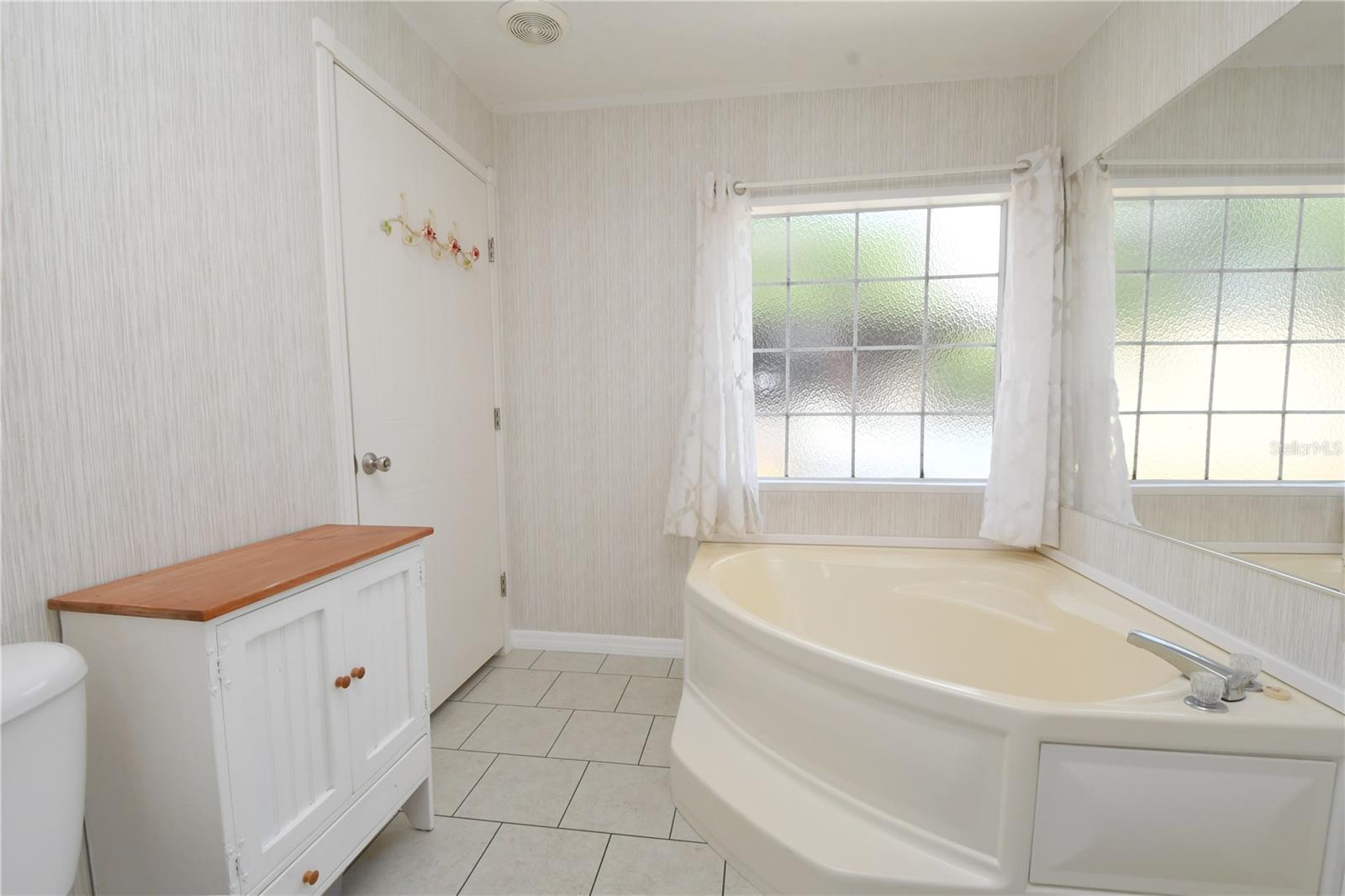 The soaking tub in the spacious master bath is the perfect place to unwind after a long day.