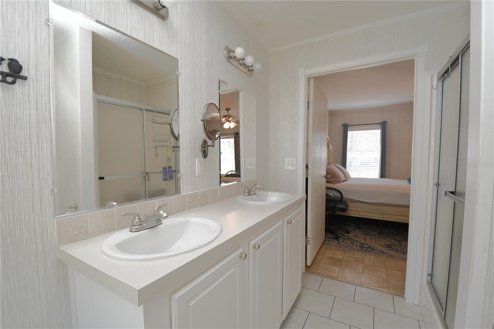 The ensuite, just steps from the master bedroom, has a walk-in shower.