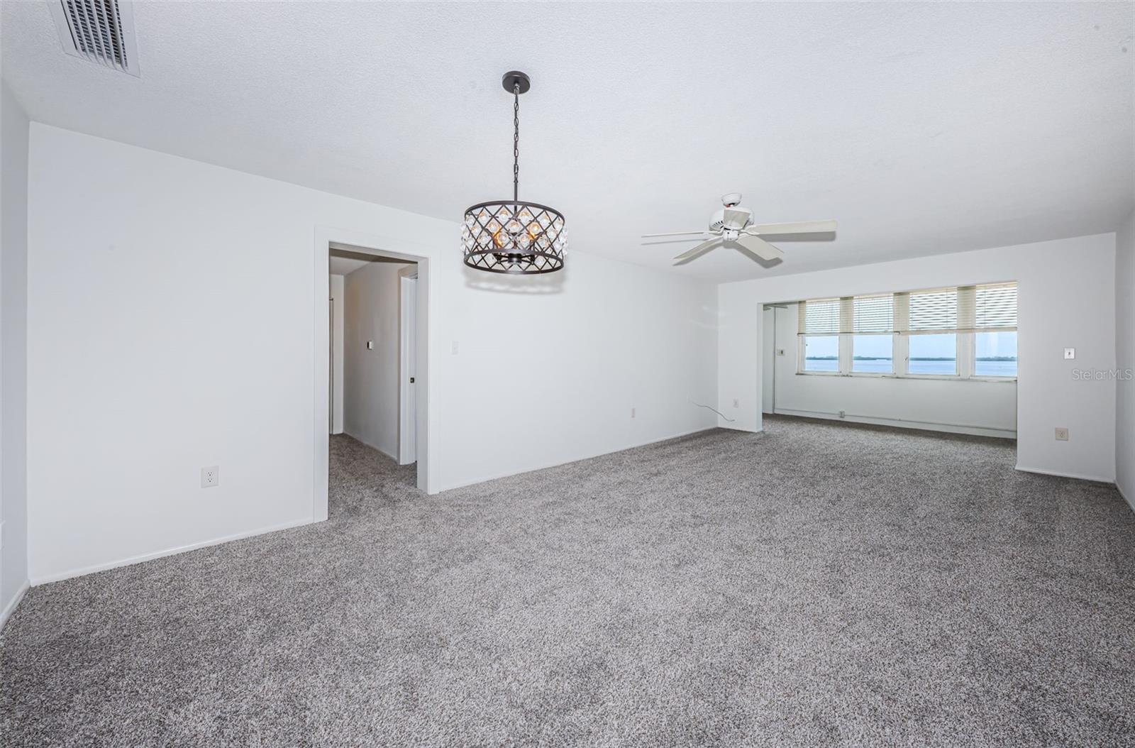 View of doing and living room looking onto the Florida room with the western waterview