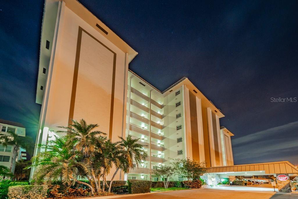 Front exterior showing portico at night.