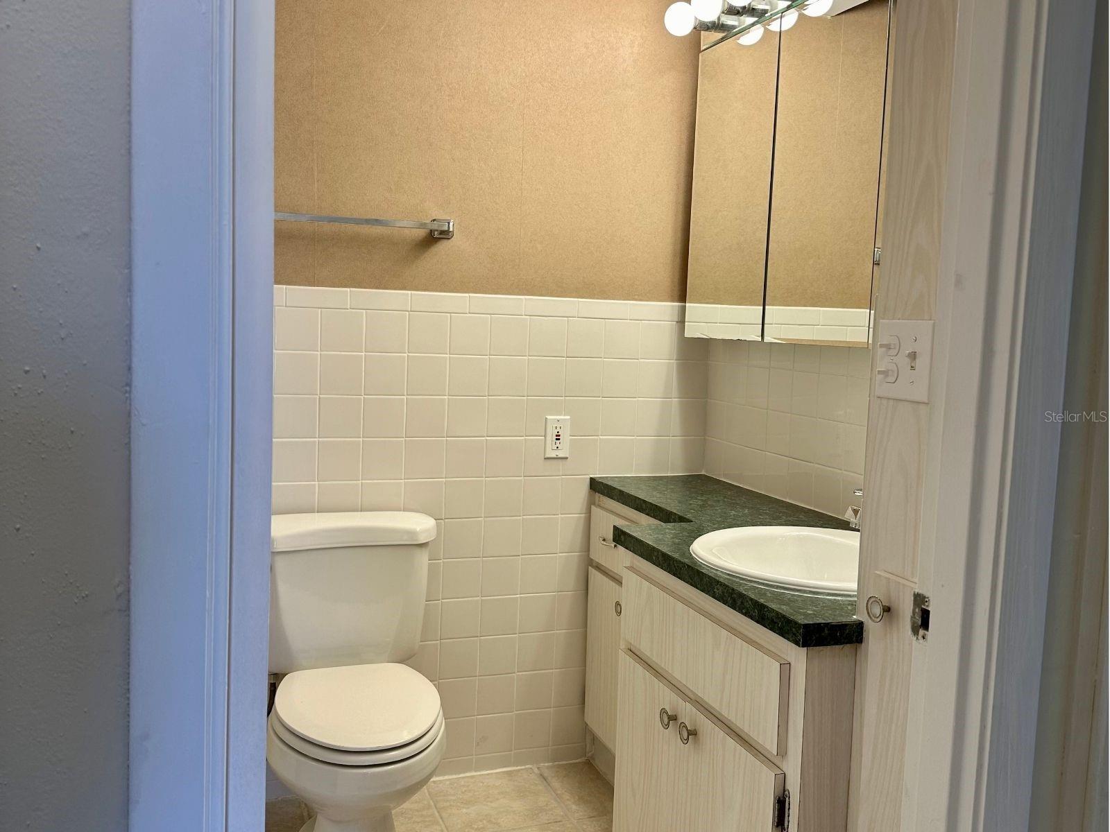 Enjoy spacious comfort! Bathroom 1 welcomes you with ample space and a convenient linen closet just down the hall.