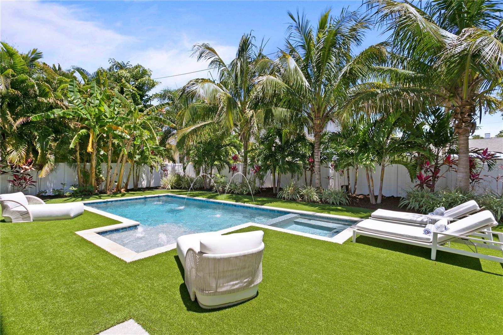 Oversized Private Backyard with heated saltwater pool, putting green and fruit trees