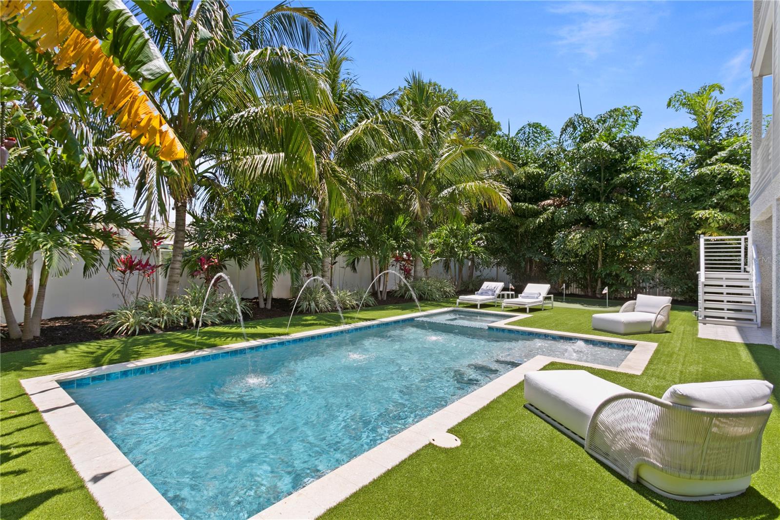 heated saltwater pool and Spa in the oversized private backyard! Features like a sun shelf, bubblers, massage jets, deck jets and multicolored lighting all controlled with your smart device