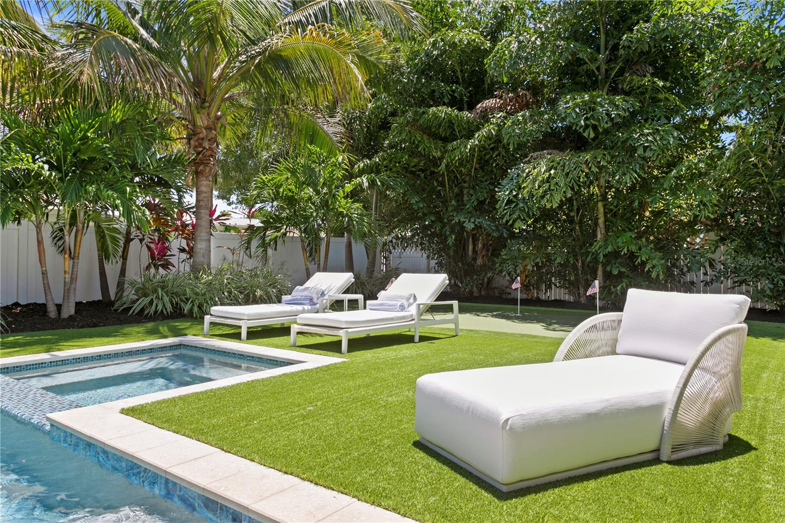 Oversized Private Backyard with heated saltwater pool, putting green and fruit trees