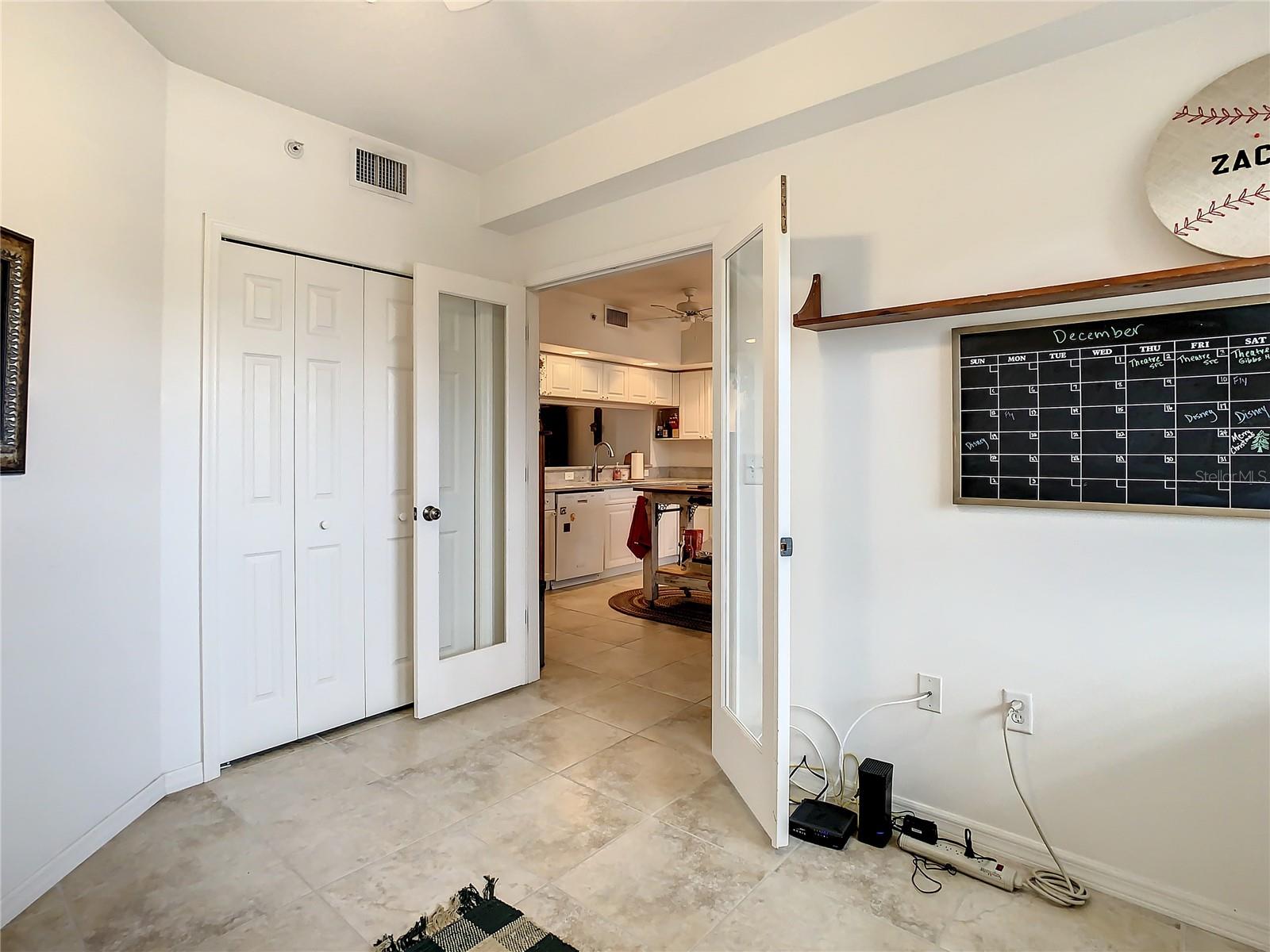 The third bedroom is located at the front of the home with stylish French doors making it perfect for an office or den