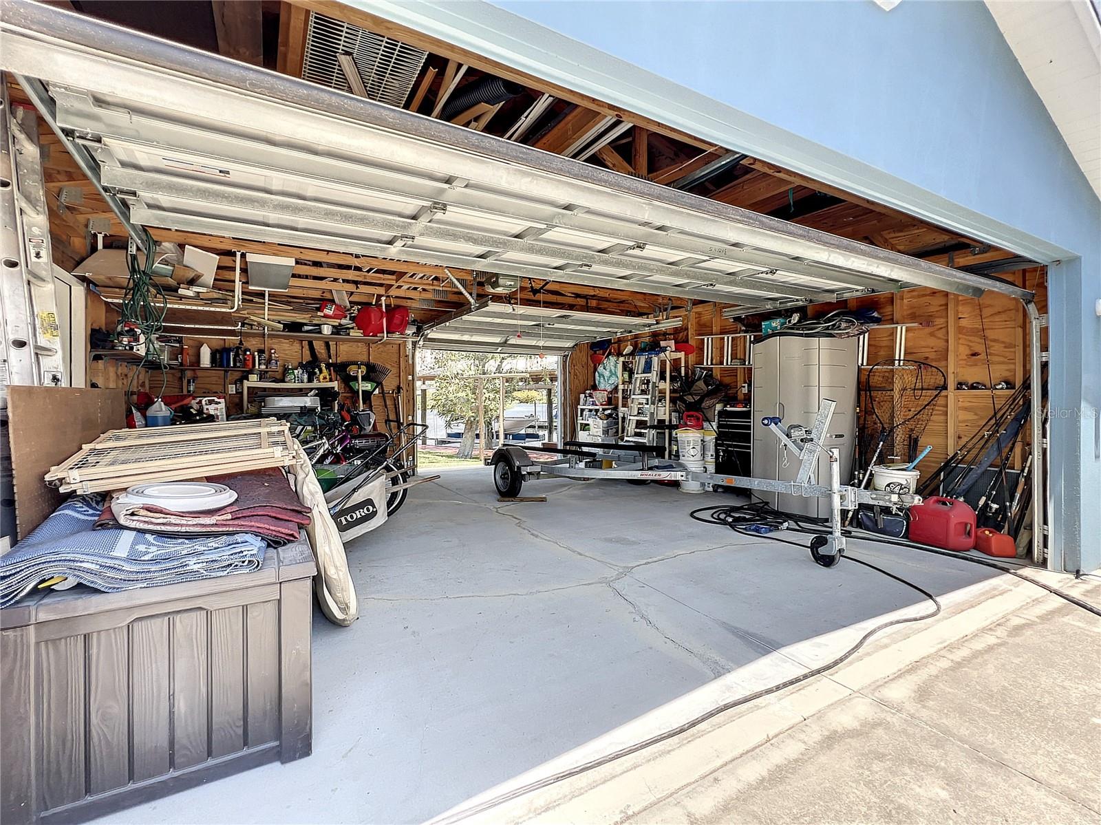 2-Car Garage with 1 Car Drive-Through making it simple to move Jet-ski's/Kayaks/paddleboards in and out effortlessly