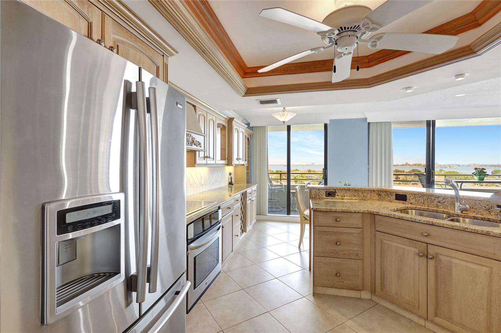 Open kitchen, panoramic water views, 75' balcony access