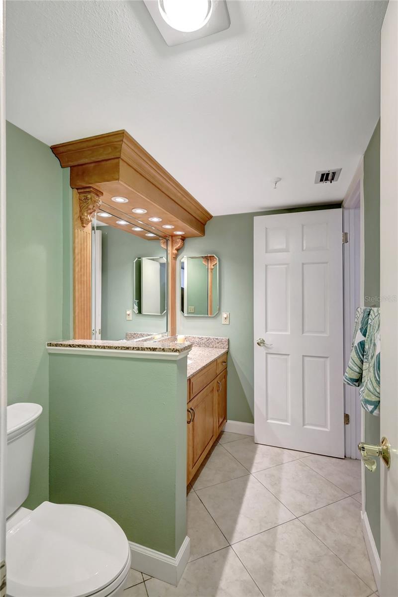 Guest Bathroom, custom cabinetry, granite counter, privacy doors