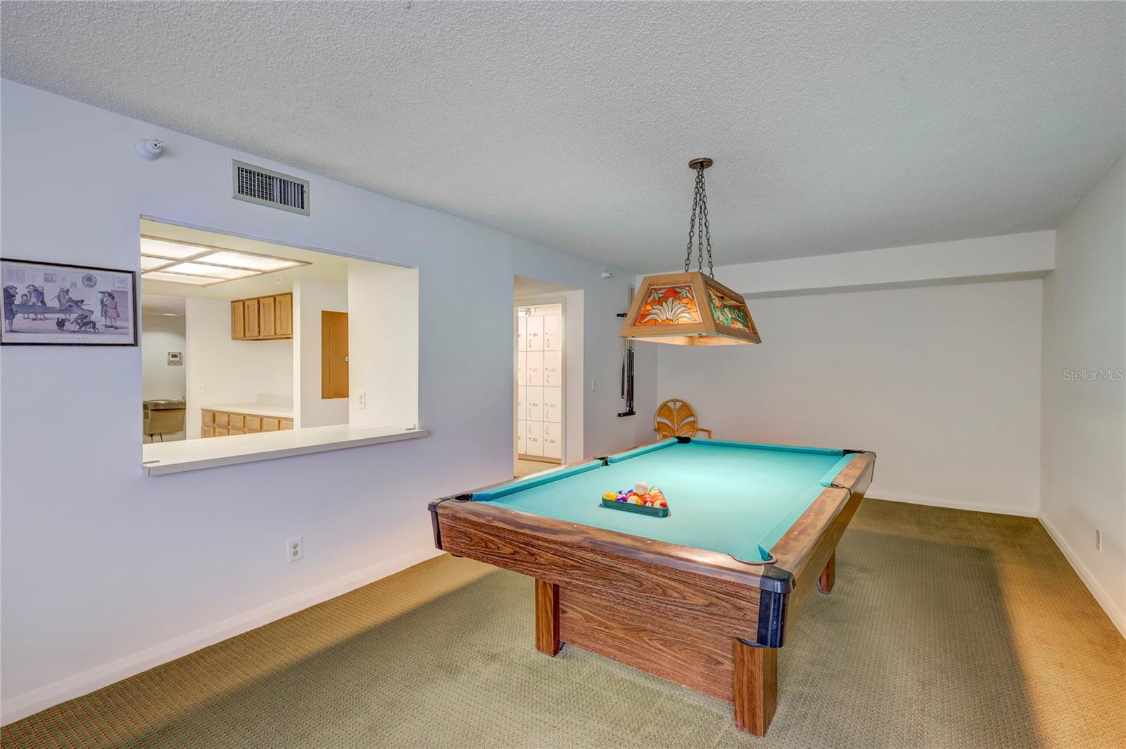 Pool table by community party kitchen