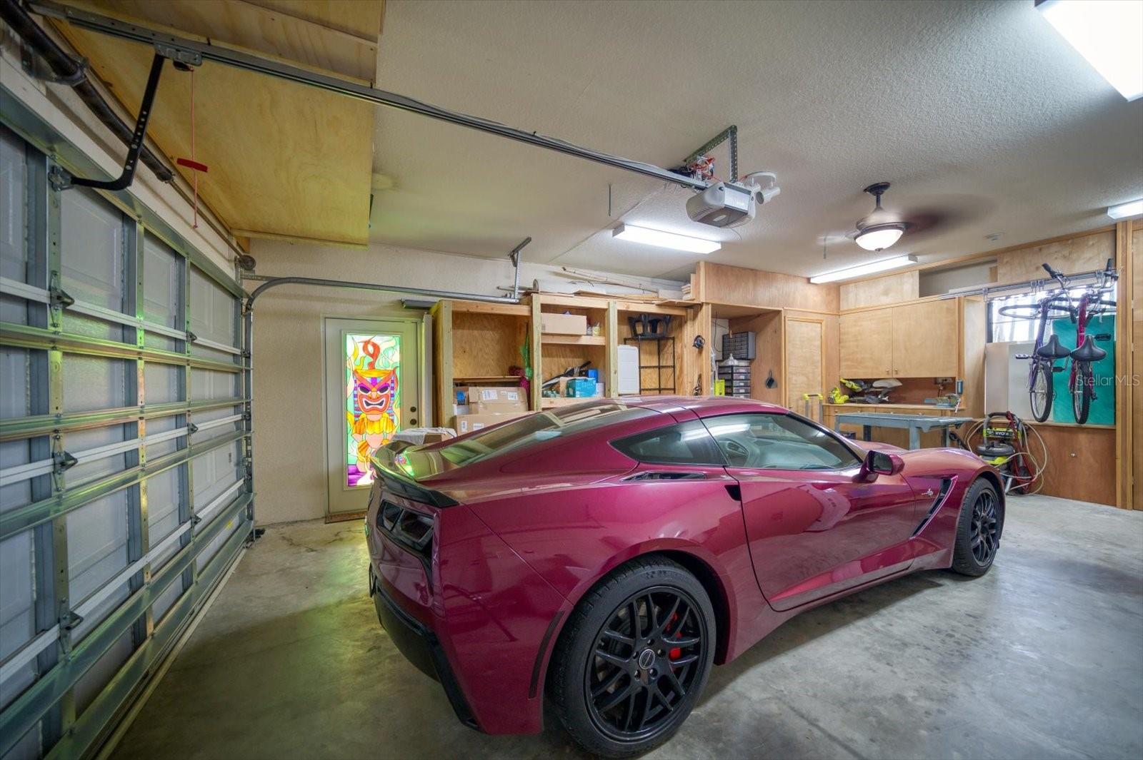 Two car garage with built in storage cabinets/closets