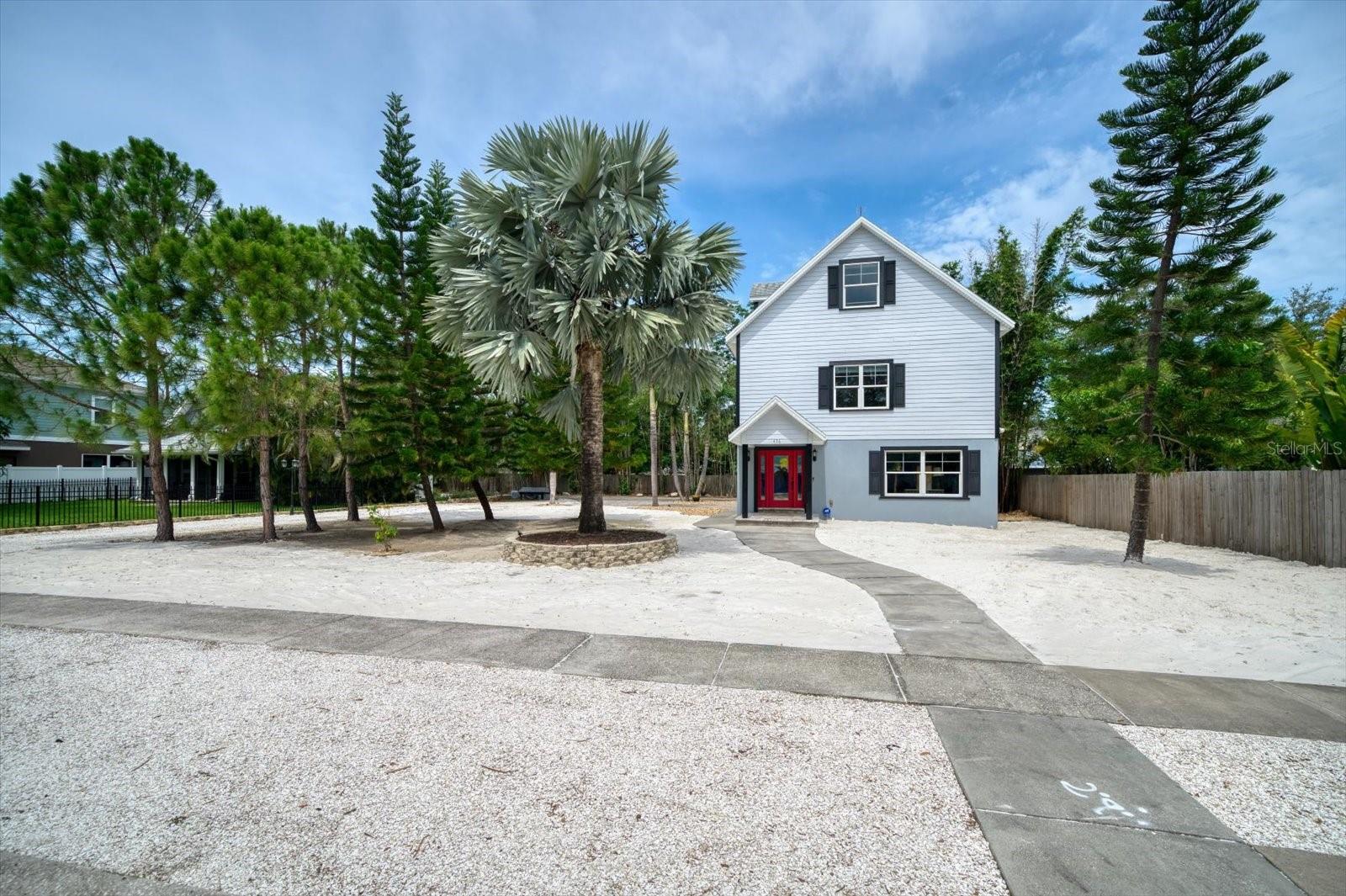 One-of-a-kind 3 story Key West Style custom home in the heart of Dunedin