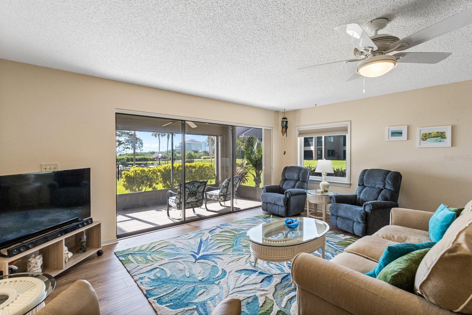 Enjoy a view of the pool and the Gulf right from your living room.