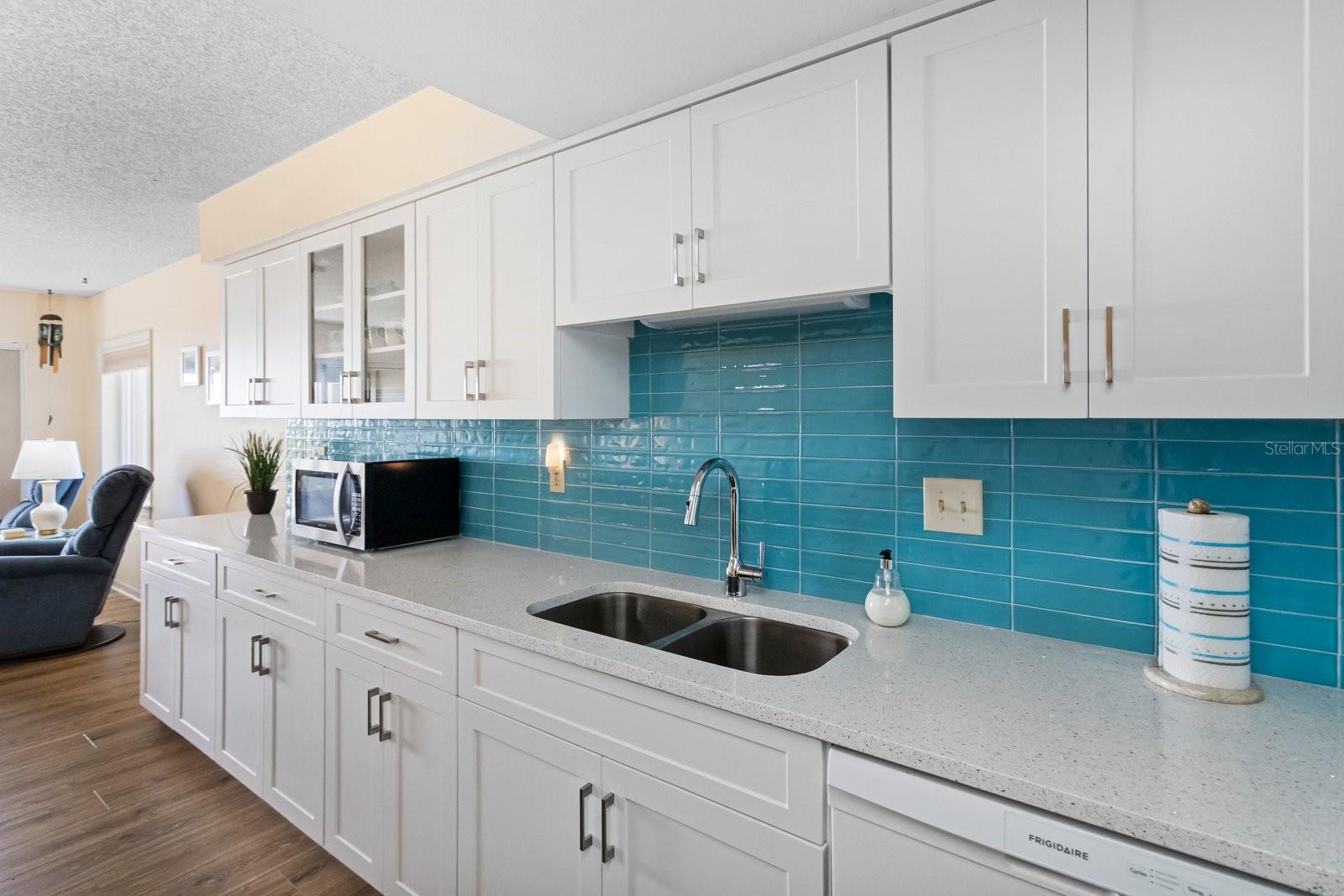 The gorgeous backsplash sparkles like the Gulf waters under the Florida sun.