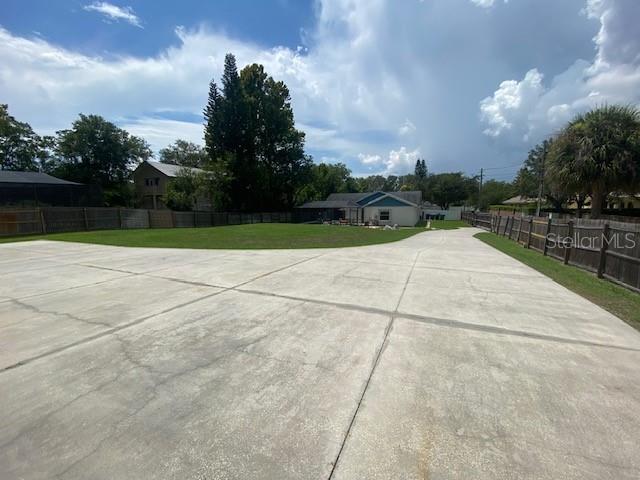 Paved driveway from RV garage to solar operated exit/entry gate.