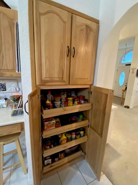 Kitchen pantry closet with slide out drawers.