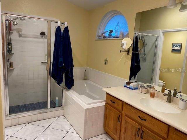 En Suite Bathroom with separate bath and shower.