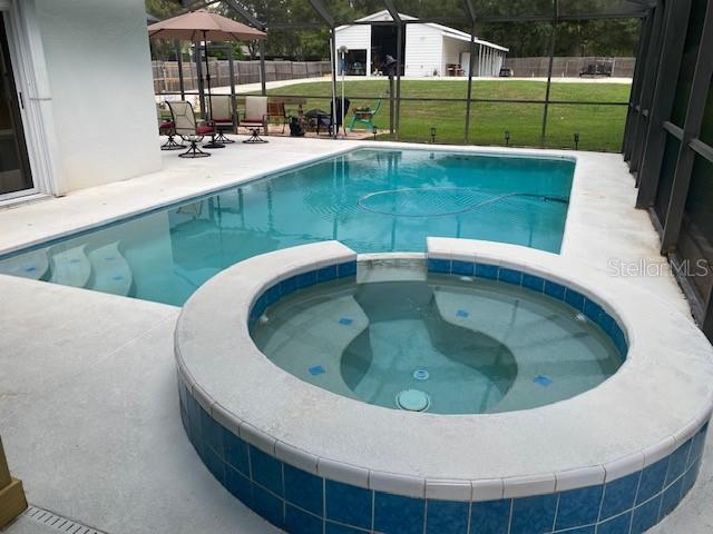 Solar heated pool with propane heated spa.