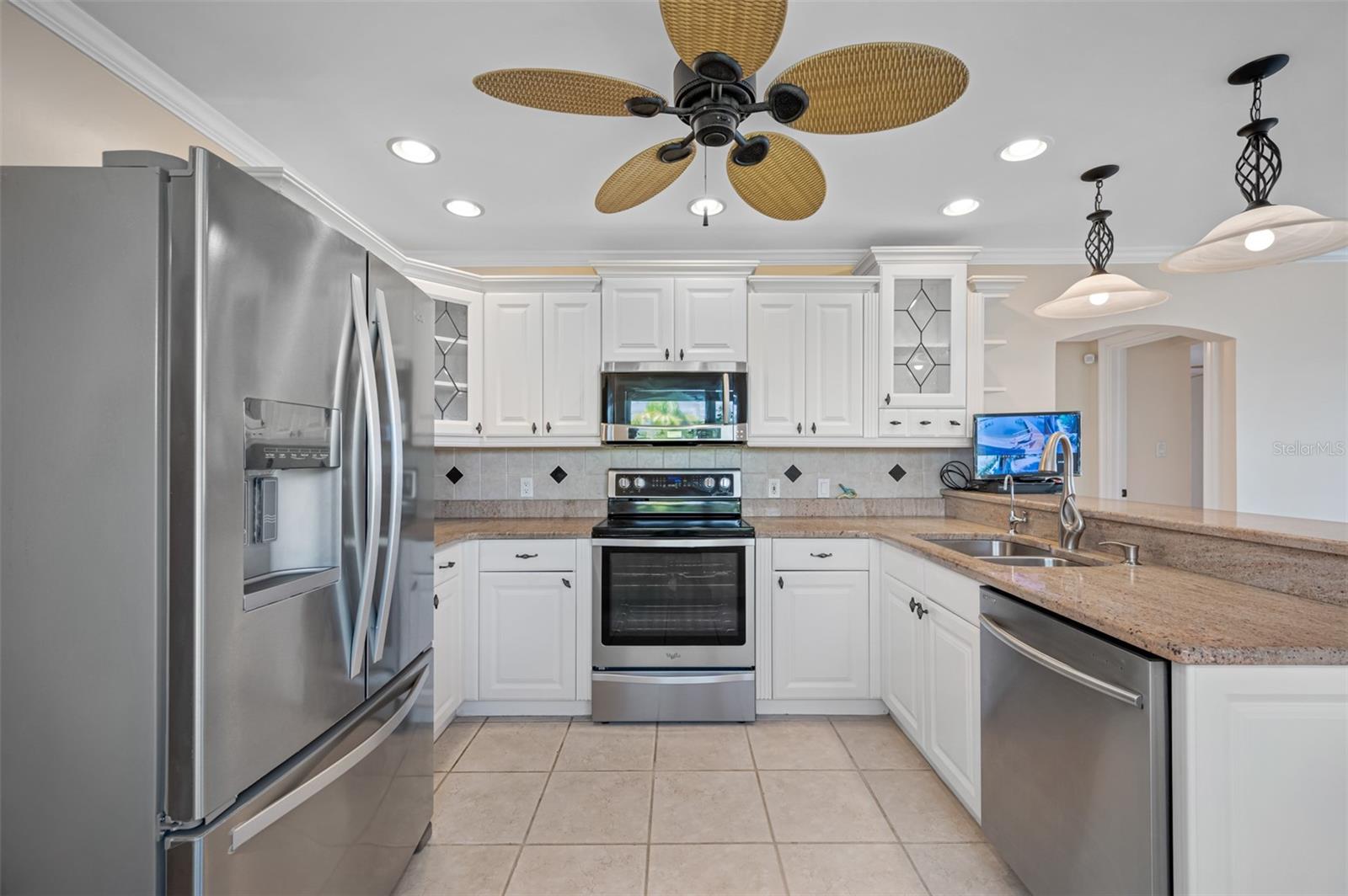 Beautiful open kitchen with updated granite countertops.