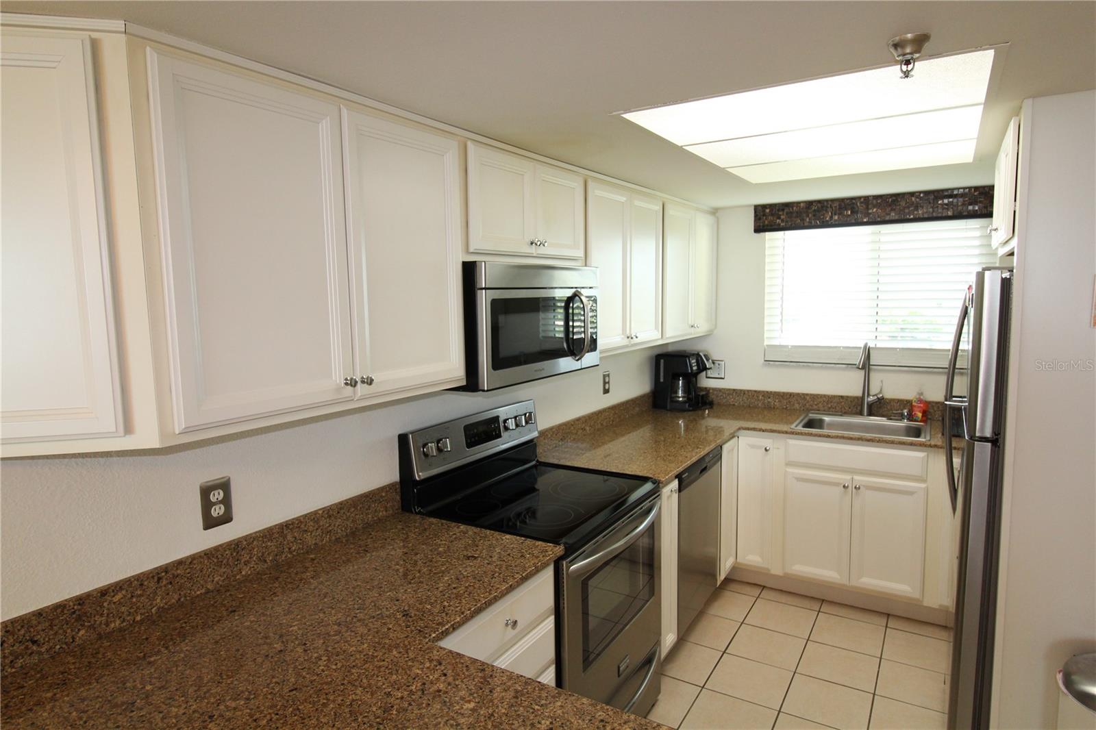 Kitchen with Grnaite Counters and Stainless Steel Appliances