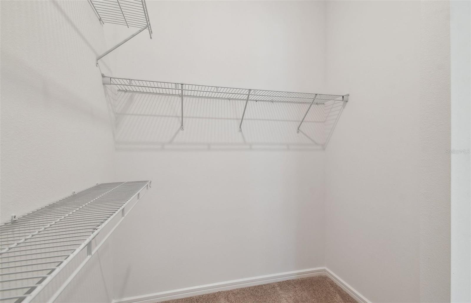 Dual Sided Owner's Walk-In Closets