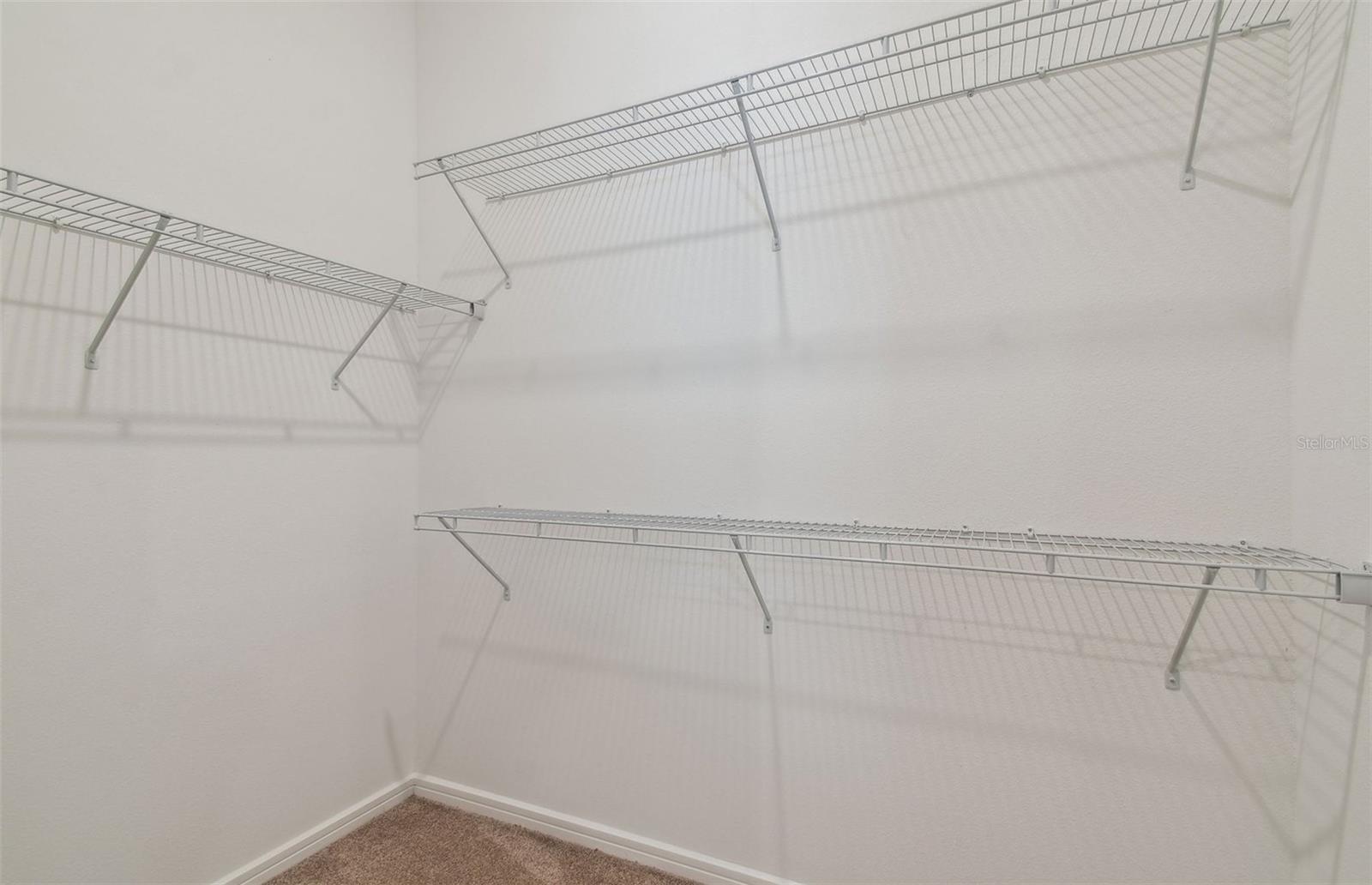 Dual Sided Owner's Walk-In Closets