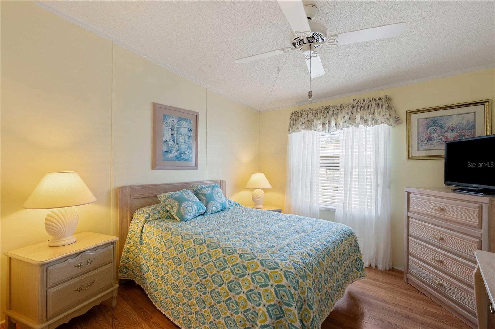 Bedroom #2 has laminate flooring, ceiling fan, and fully furnished.