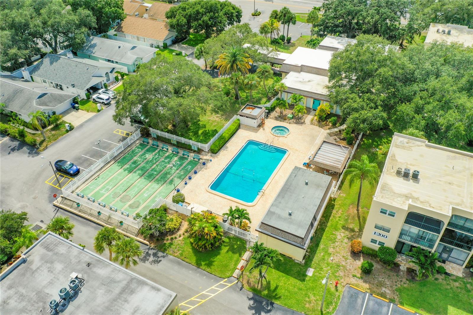 Large community pool and shuffleboard courts
