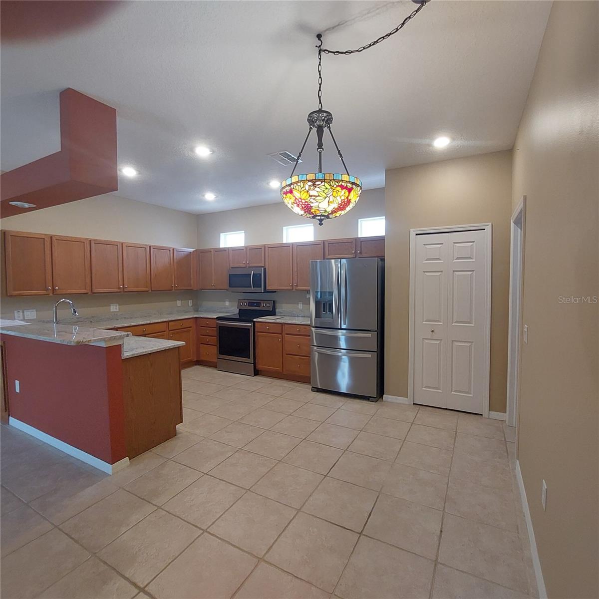 all stainless appliances, recessed lighting, newer granite counter tops