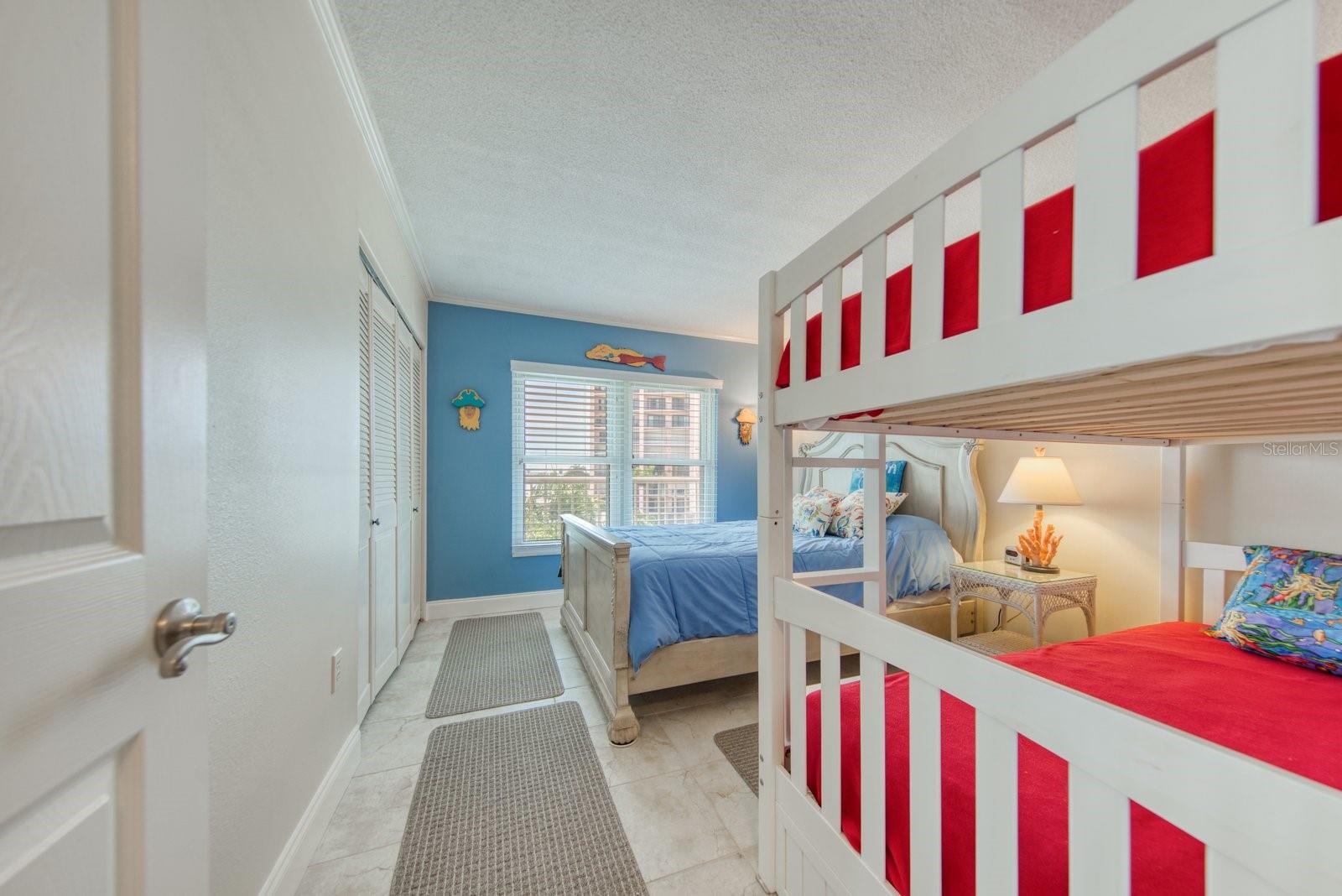 2nd bedroom with queen and bunk beds