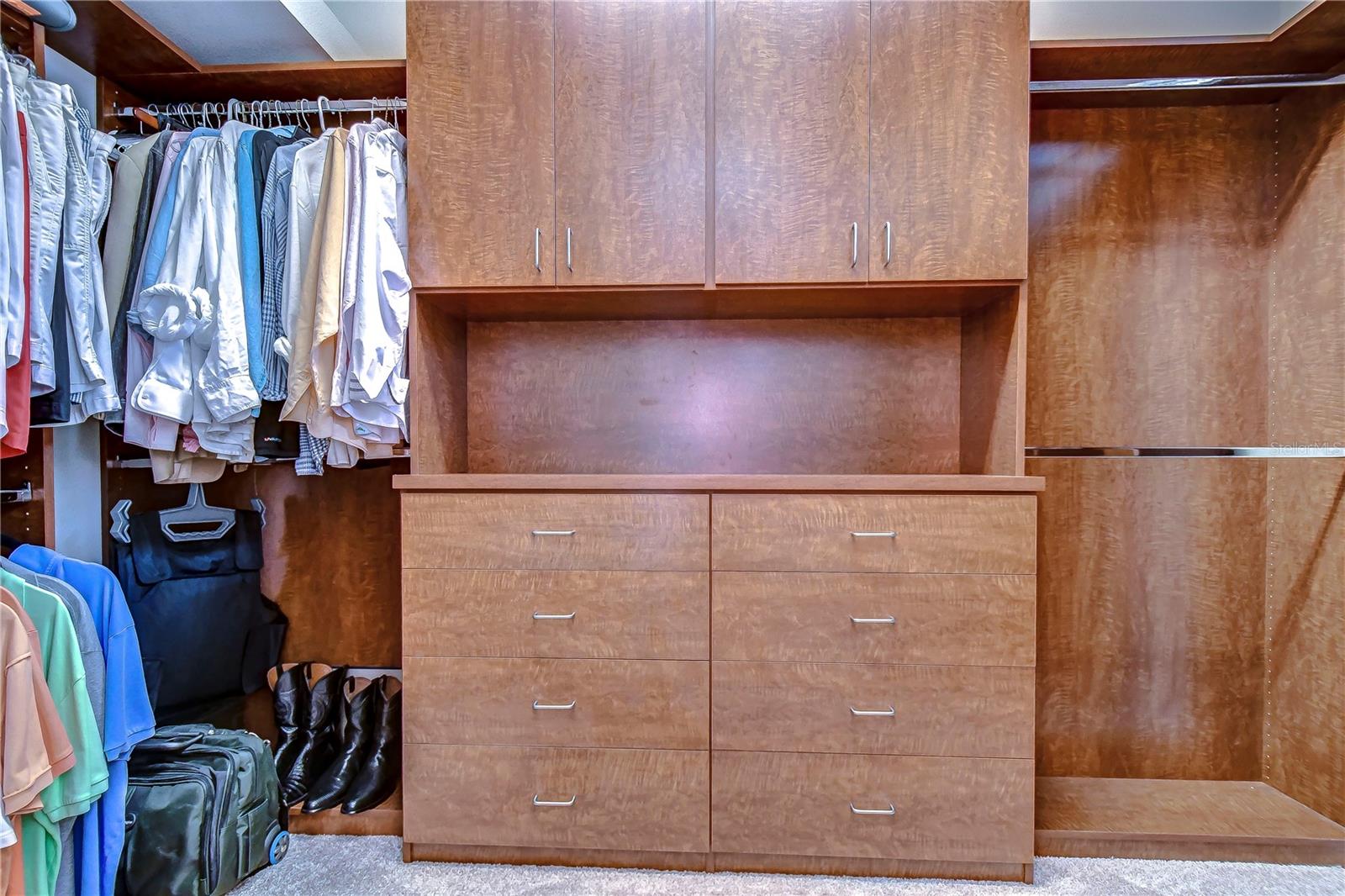 Walk-in closet adorned with custom organizational shelves!