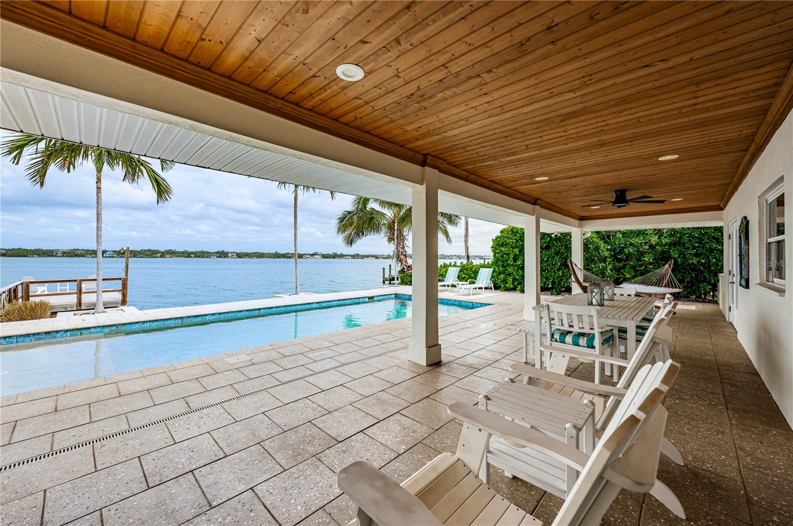 Covered patio pool and open water views
