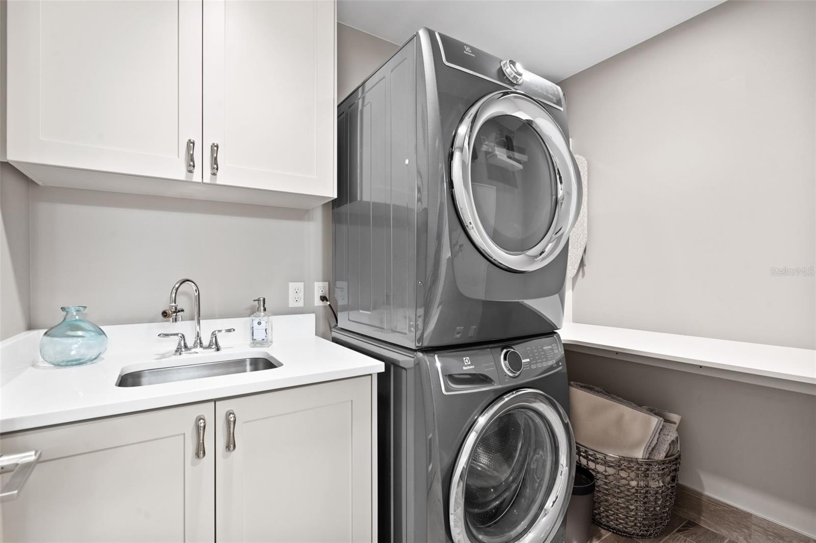 Spacious Laundry Room with Sink and Work Counter