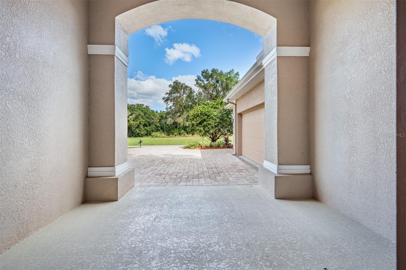 Arched Entry to Spacious front porch