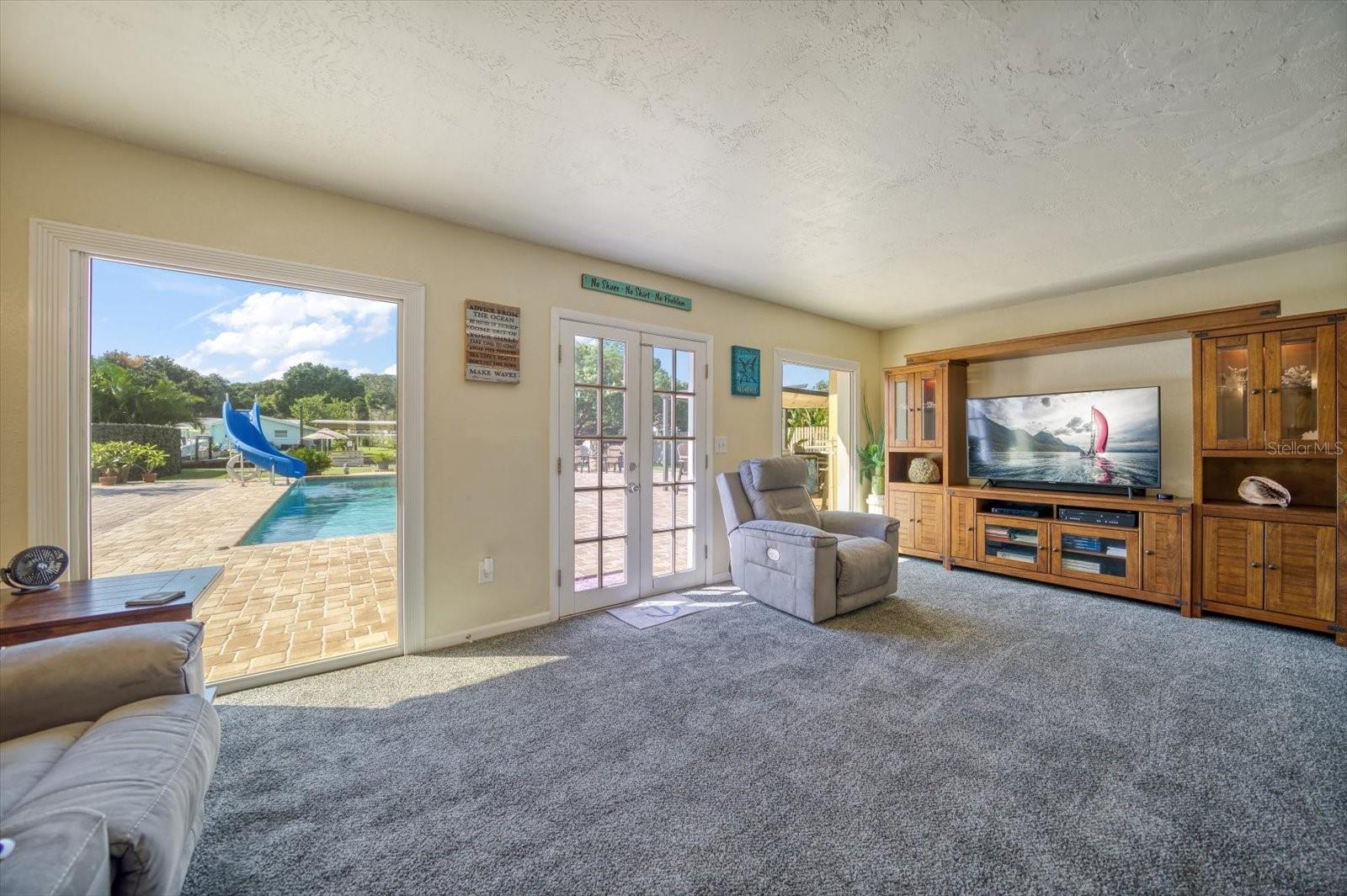 Family room with views of your park like backyard setting.