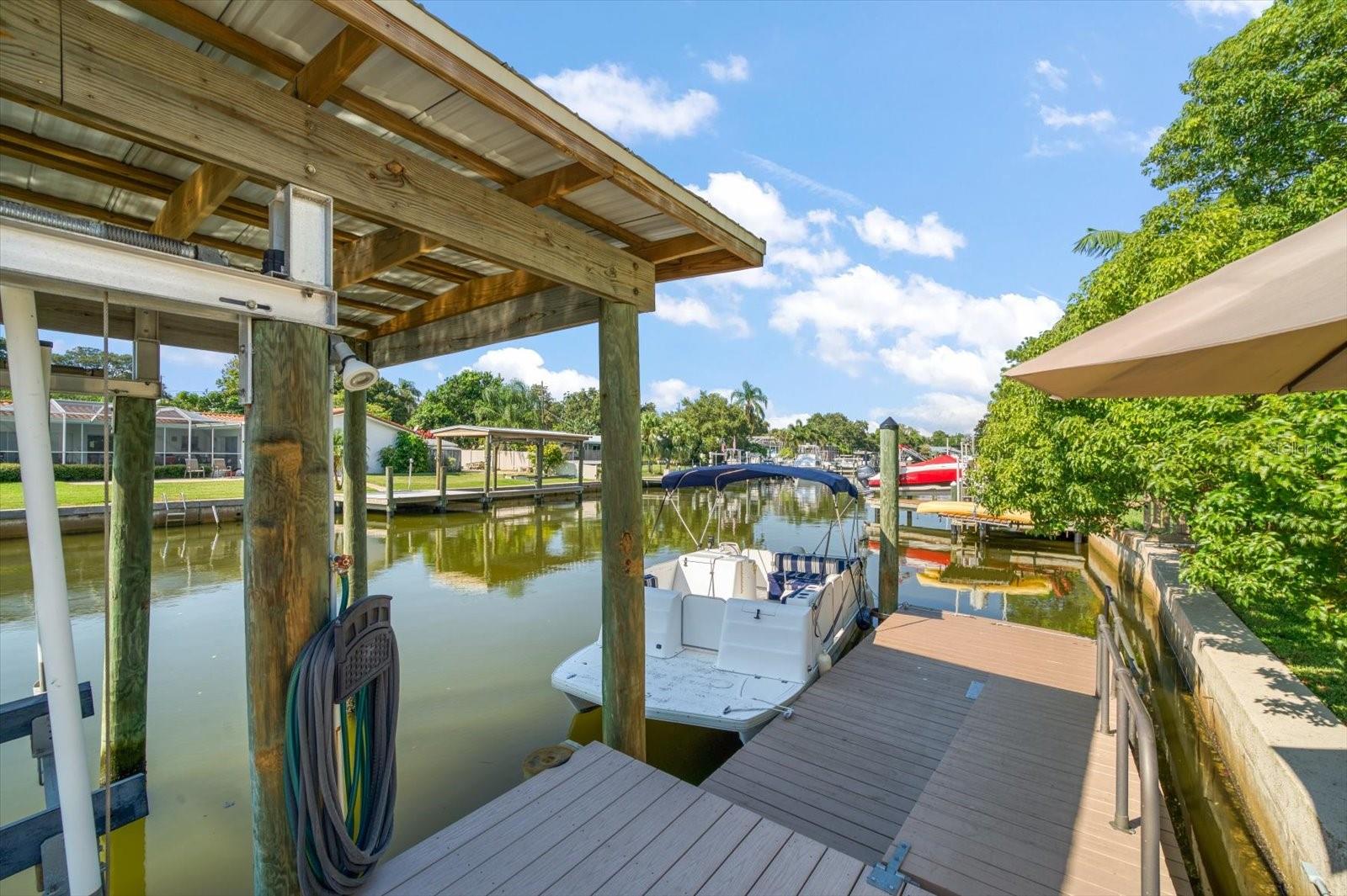Dock with electric and water, composite decking, protective boat house..exceptional set up for boaters.