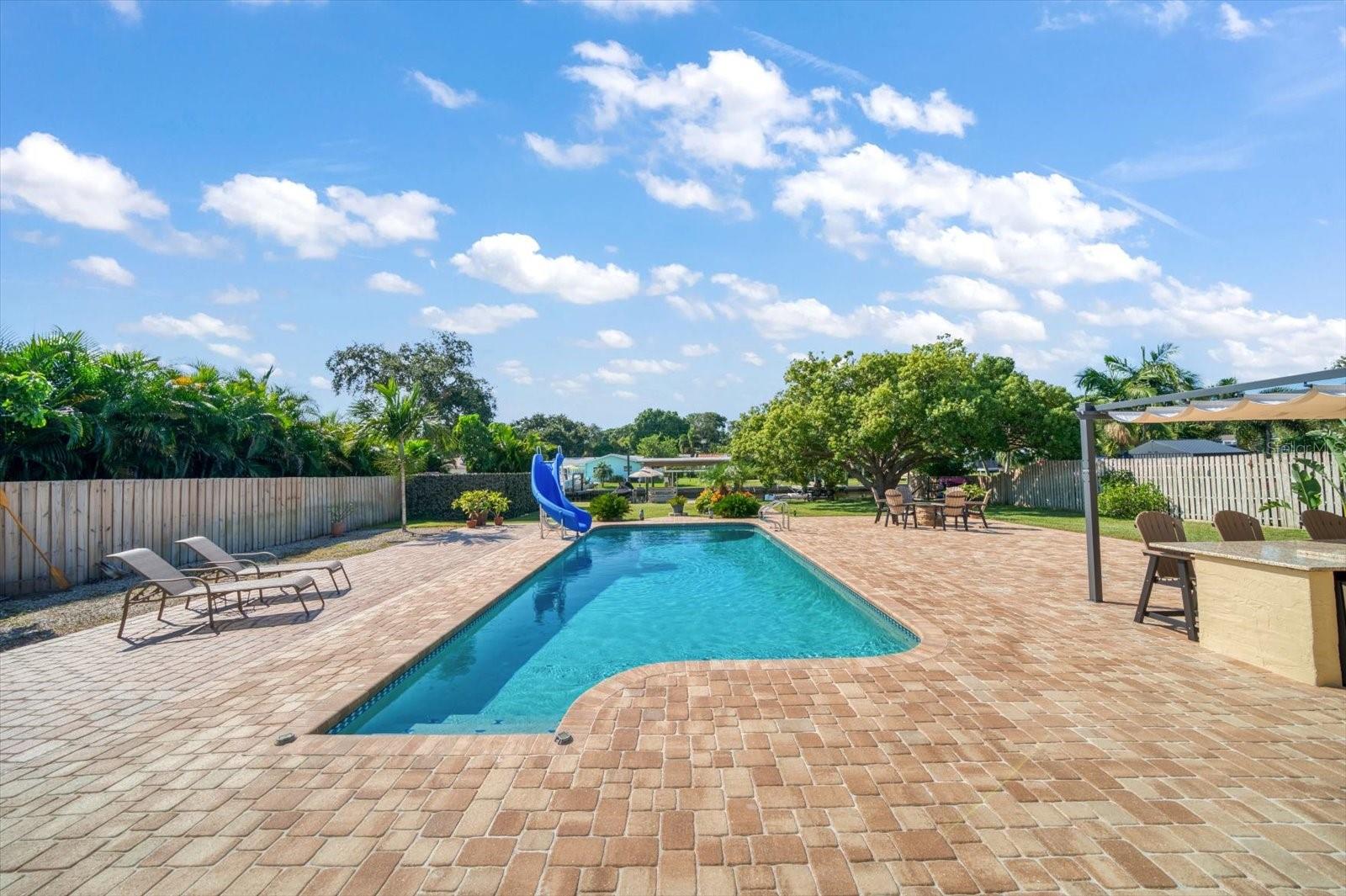 Impressive, spacious and private yard with a spectacular 15x35 ft. Heated pool.Imagine the fun…ALL year!