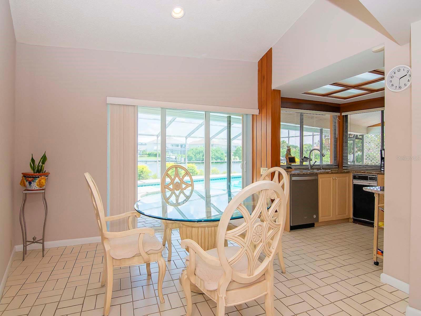 Eat-In Kitchen Area with outside view of pool and waterway