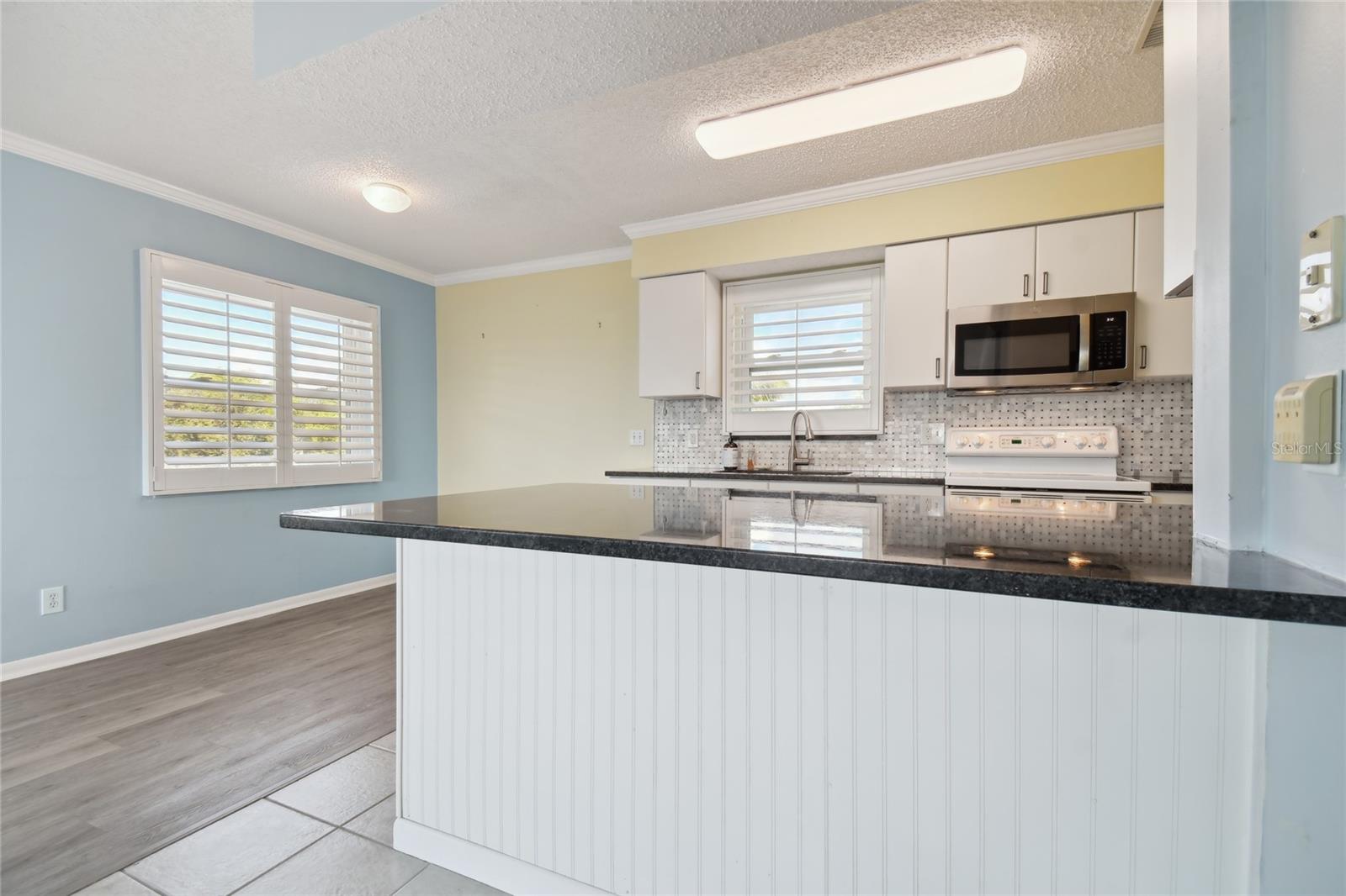 Granite countertops and wood cabinets