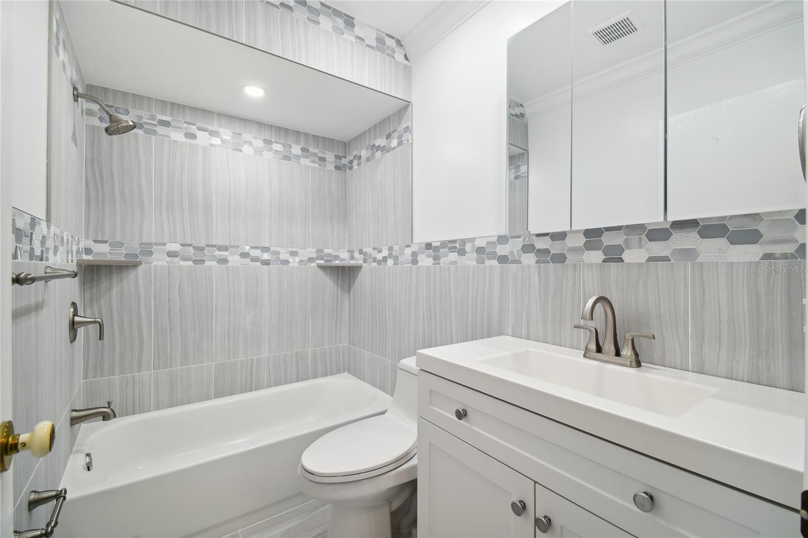 This is the hall bath area, that was remodeled 2 years ago with nice finishes and tub shower combination.