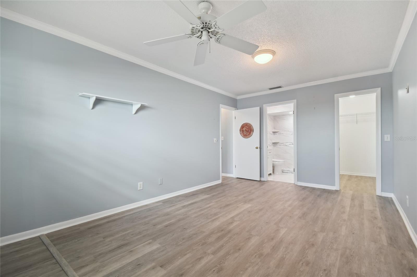 Primary bedroom with walk in closet and en suite bathroom, and don't forget the open water view!