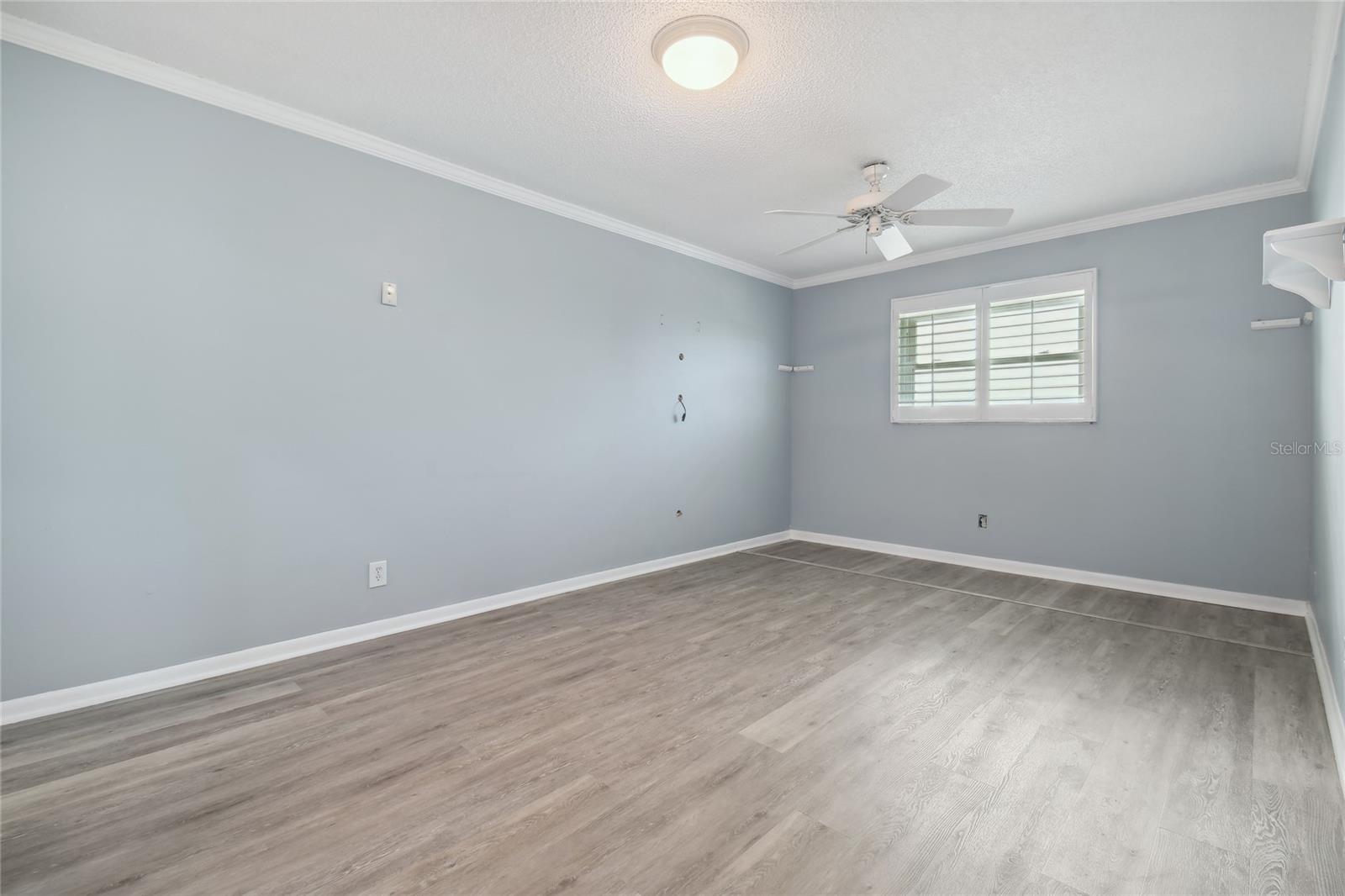 This the primary bedroom with an en suite bathroom and walk in closet but not to forget the beautiful view of open water that will never get old waking up to.