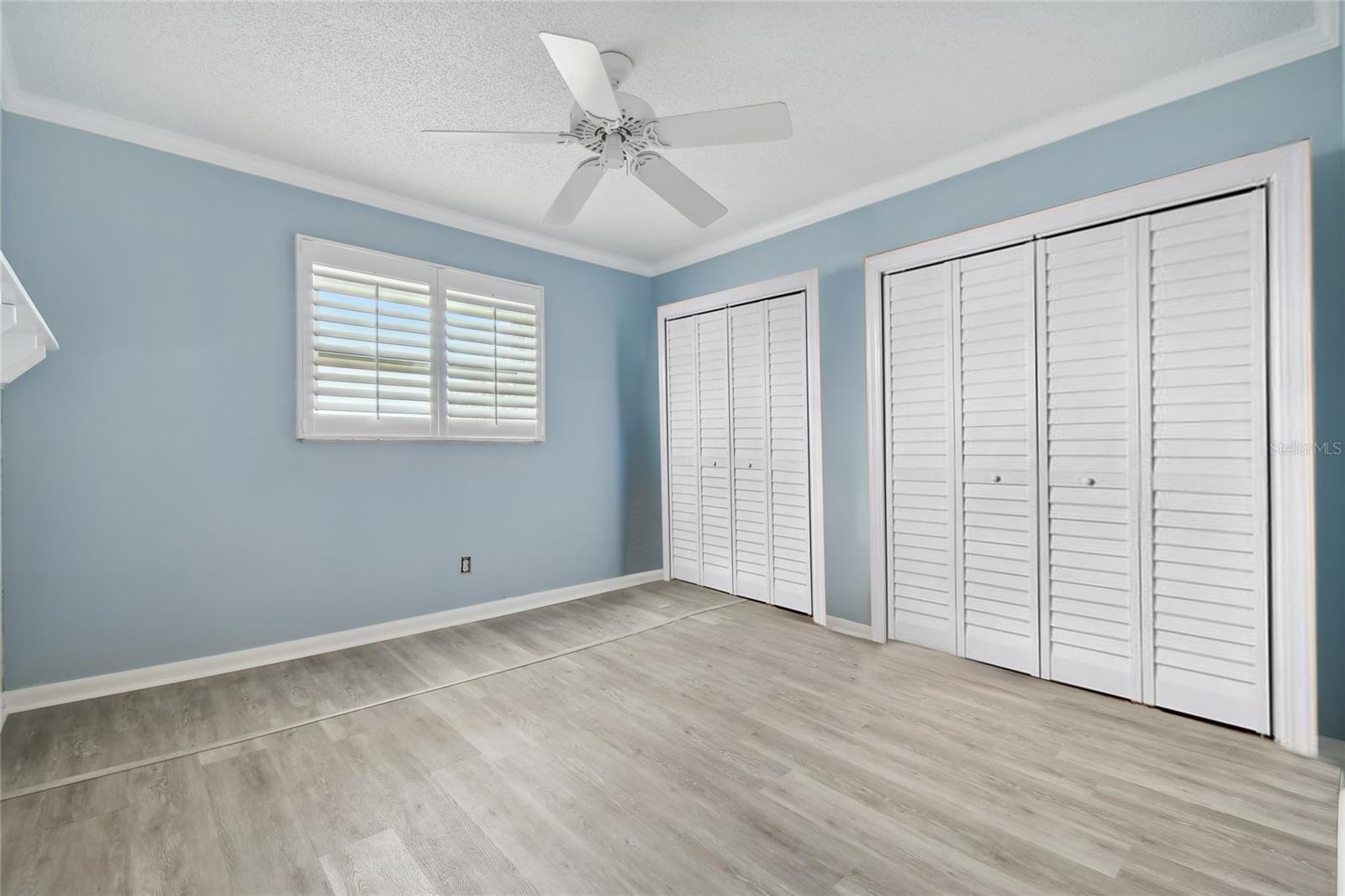 This is the 2nd bedroom with plenty of closet space, and a window that looks out over the open water view.