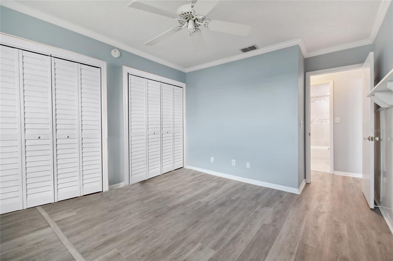 2nd bedroom area leading to the hallway, with luxury vinyl flooring that was put in a year ago.