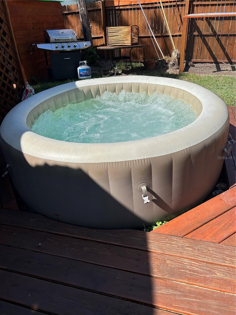 Spa tub with wrap around deck