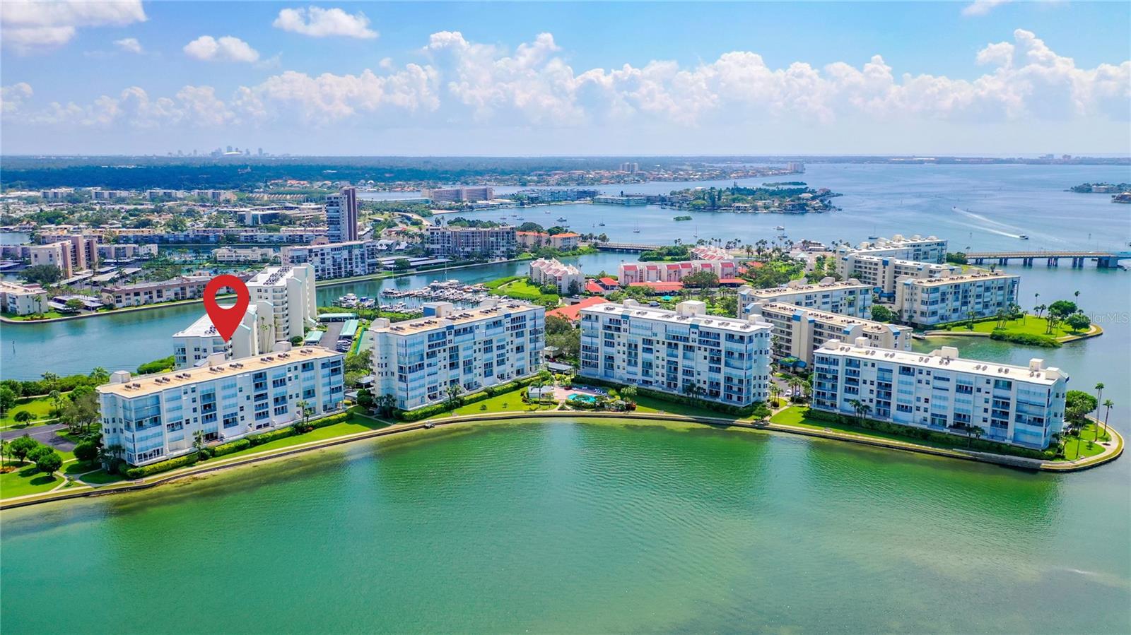 Aerial view of part of the gated community of Harbourside.  You can see the building where this unit is located with red arrow.  Great location!
